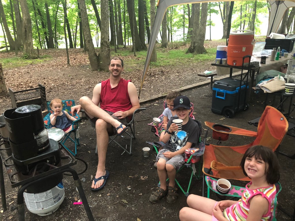 Camping with kids dad hanging out at campsite with kids